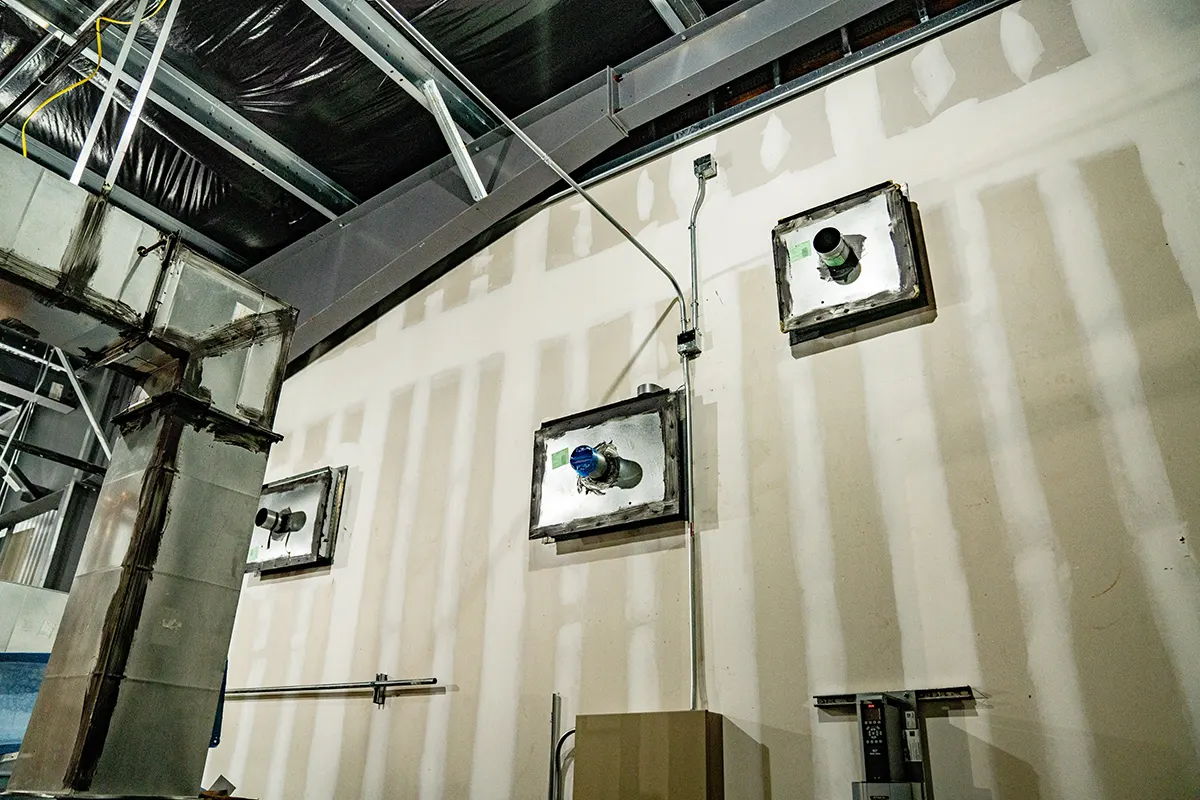 Ductwork along an interior wall